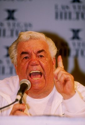 17 Mar 1990: Trainer Lou Duva shouts into a microphone during a press ...
