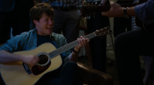 John Gallagher Jr. as Jim Harper playing guitar on The Newsroom Season ...