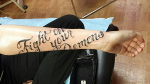 Fight off your demons. Quote tattoo.