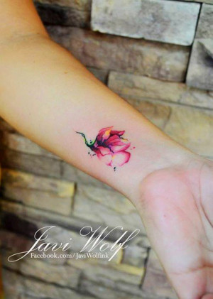 Flower watercolor tattoo on girls wrist | watercolor flower tattoo ...