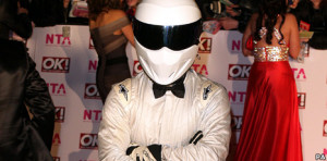 The Stig trains a celebrity how to race round the Top Gear track each ...