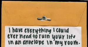 An envelope with a blackmail note on it.