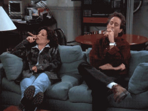 Elaine Benes ( Julia Louis-Dreyfus ) and Jerry Seinfeld sit on a couch ...