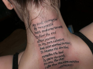 ... biblical quote running down from the back of the neck along the spine