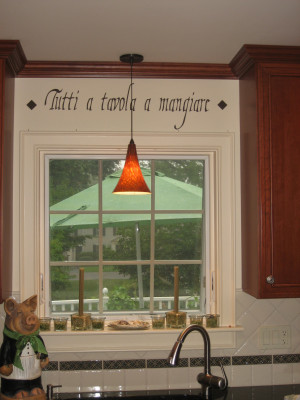 An Italian kitchen wall quote above the kitchen window and in between ...