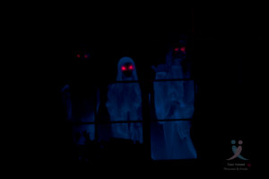 Ghosts in the window during halloween.
