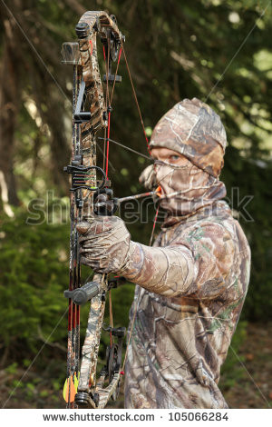 stock-photo-bow-hunter-in-camouflage-pulling-bow-back-closeup ...