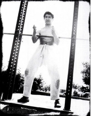 Bruce Lee conducts dynamic tension training on one of the many ...