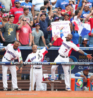 (left) celebrates with Dominican Republic teammates Robinson Cano ...