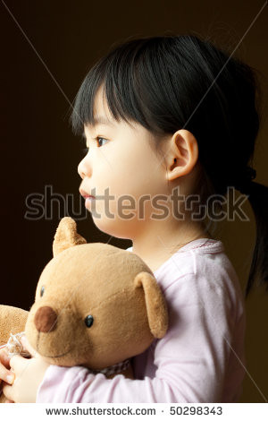... because it sad little girl holds a teddy portrait of sad little girl