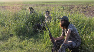 This publicity image released by A& E shows, from left, Phil Robertson ...