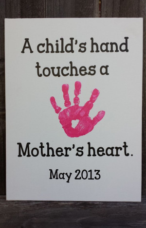 ... on a canvas with vinyl quote-A Child's hand touches a Mother's heart
