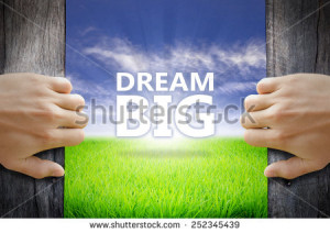Dream Big motivational quotes. Hand opening an old wooden door and ...