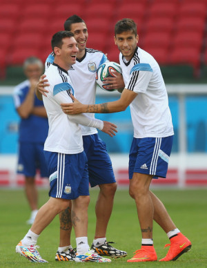 Angel Di Maria (L-R) Lionel Messi of Argentina has a laugh with Angel ...