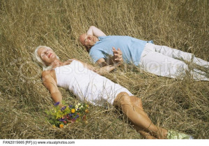 senior_couple_laying_in_the_grass_together_FAN2015665.jpg