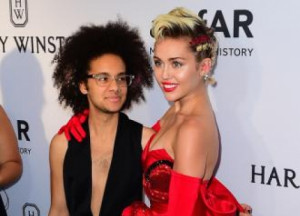 Miley Cyrus attends amfAR Inspiration Gala with 'agender' date