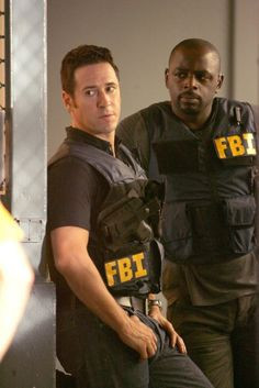 ... Eppes (Rob Morrow) and David Sinclair (Alimi Ballard) in Numb3rs. More