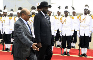 South Sudan's President Salva Kiir is welcomed by Sudan's President ...