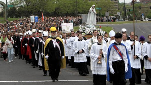 Marchers head up John Ireland Boulevard on the way to the Cathedral of ...