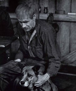 Movie still photo of Candy (John F. Hamilton) holding his old dog.