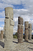 Mexico, Tula, Toltec Ruins, stone sculptures lined up in row, clouds ...