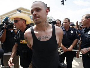 ... of the sheriff's department confronts a white supremacist during