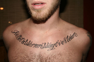 ... with sharp angles gives an edgy look to this urban chest quote tattoo