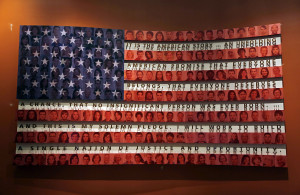 flag bearing a quote about immigration by former President George W ...