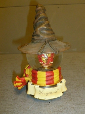 This snow globe depicts the Harry Potter Movie, and is labeled ...