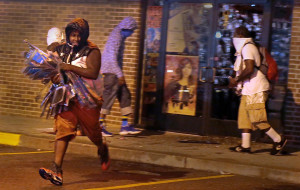 Image: Protesters defy police, take to the streets of Ferguson