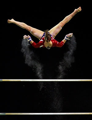 the U.S. competes in a qualifying session of the women's Uneven Bars ...