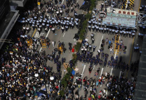 Policemen, at top in this photograph, urge pro-democracy demonstrators ...