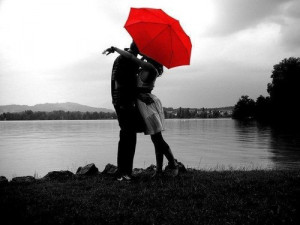 Two lovers in the rain have no need for an umbrella.