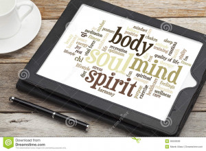 Mind, body, spirit and soul - word cloud on a digital tablet.