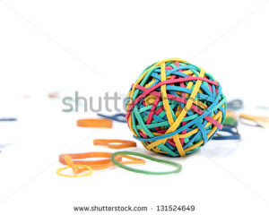 Brightly coloured Rubber band Ball on white background - stock photo