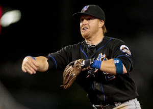 New York Mets third baseman Justin Turner throws to first to get the ...