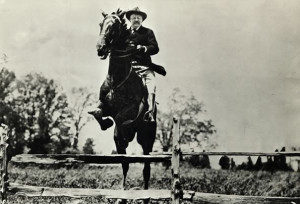 Teddy Roosevelt Whips Young Lady Passing Him on Horseback