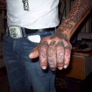 Vybz Kartel has a lot of tattoos all over his hands but we are not ...
