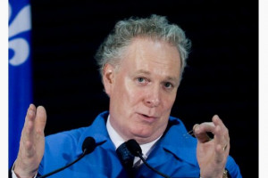 Quebec Premier Jean Charest is the victim of a prank seasons-greetings ...