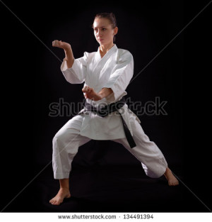 -karate-girl-with-black-belt-posing-champion-of-the-world-on-black ...