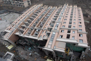 Building collapses in its entirety (Shanghai,China - July 2009)
