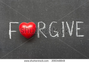 forgive word handwritten on chalkboard with heart symbol instead of O ...