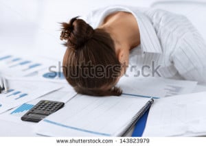 picture of woman sleeping at work in funny pose