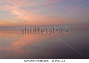 courageous man on thin ice leaves to other coast - stock photo