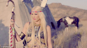 Yeehaw! Gwen Stefani dresses as a Native American, cavorts with a wolf ...