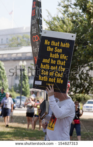 11 Truthers hold signs with religious quotes on September 11, 2013 ...