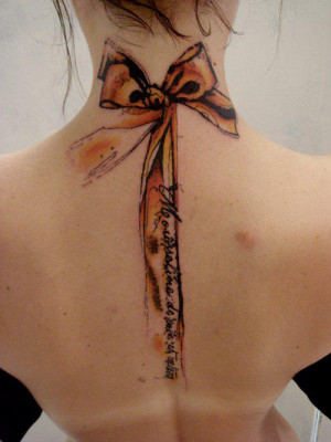 Home » Back Tattoos » Realistic ribbon tattoo on back