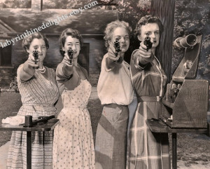 of a newspaper showing women practicing with revolvers. The women ...