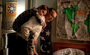 Thomas Horn (left) portrays the son of Tom Hanks (right), who has died ...