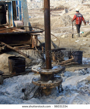 - FEB. 4: A roughneck maintains a drilling rig at a producing oil ...